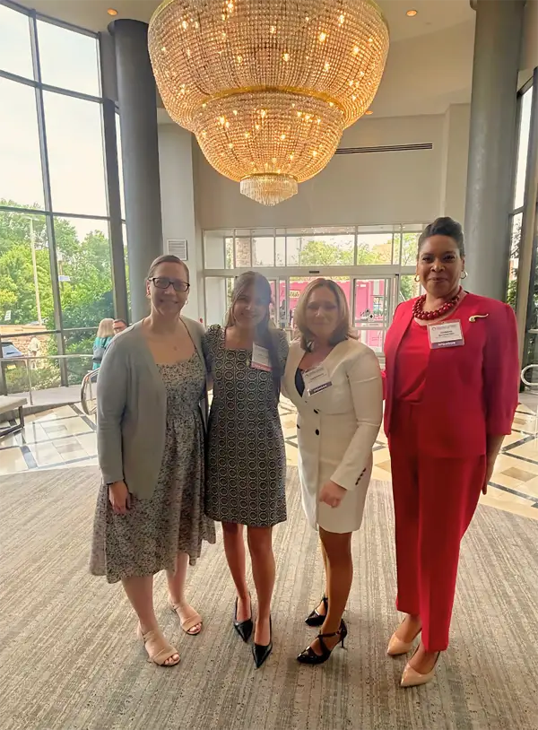 Four women who attended the chamber meeting