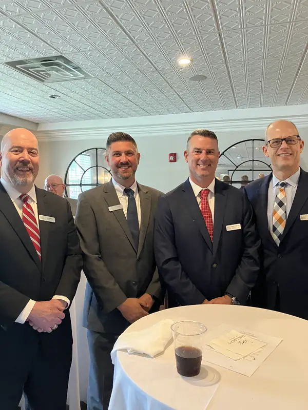 Four men attending the meeting