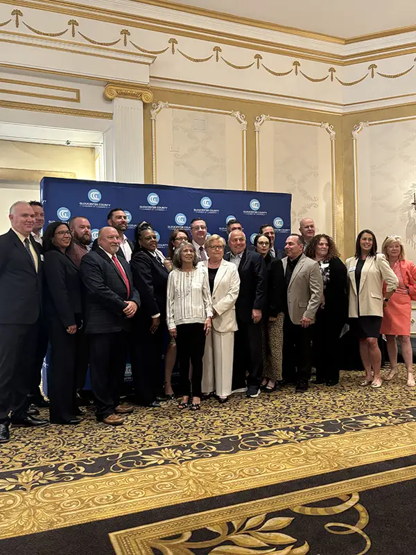 Large group of chamber members posing for a picture.