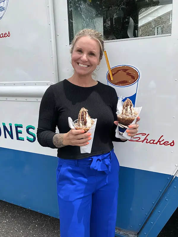 Elmer Bank employee with ice cream in both hands.