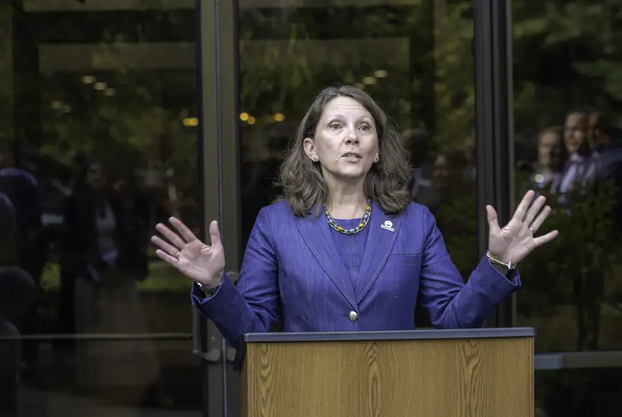 Allison Eckel speaking at podium